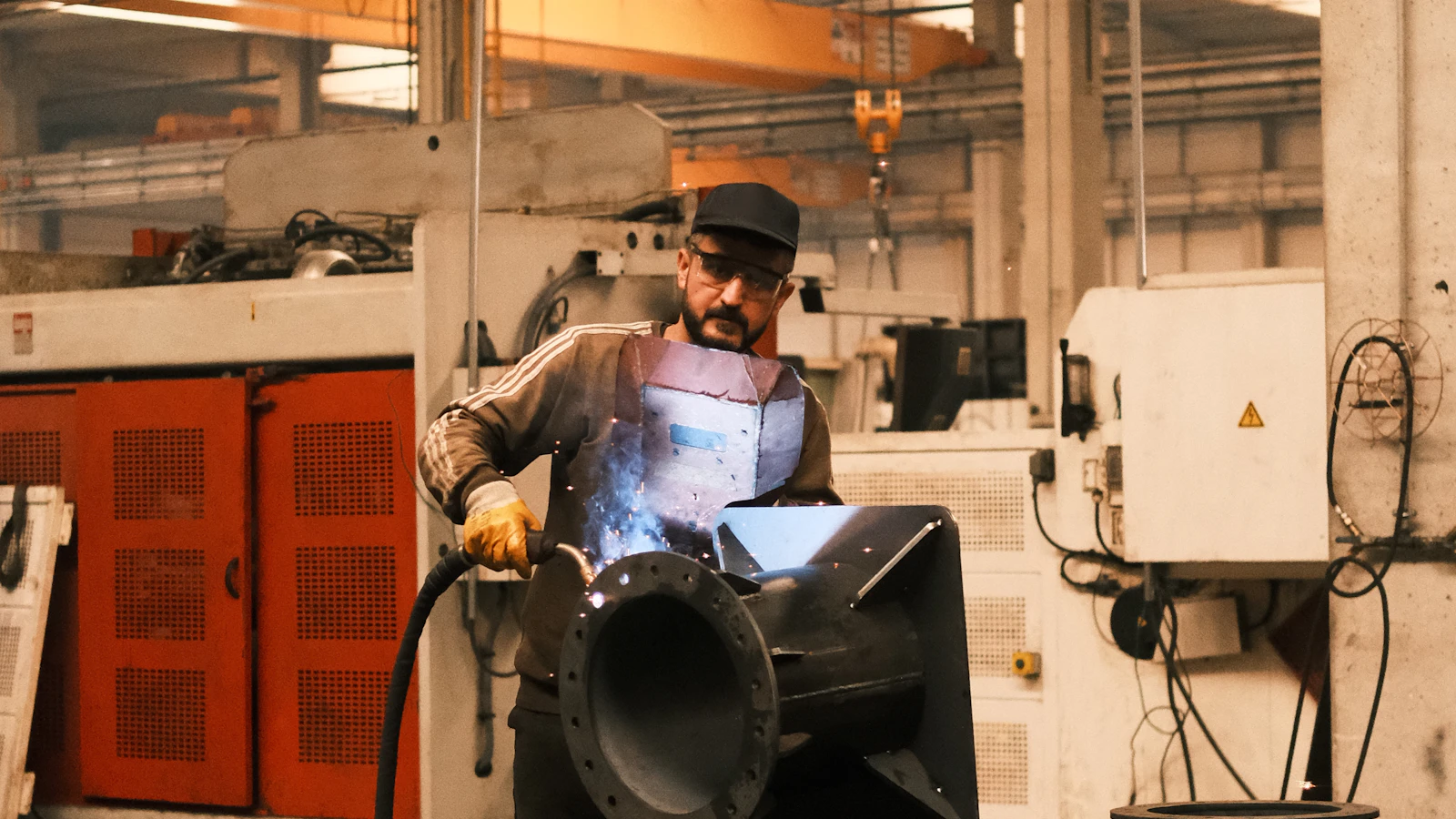 A man working on a machine in a factory