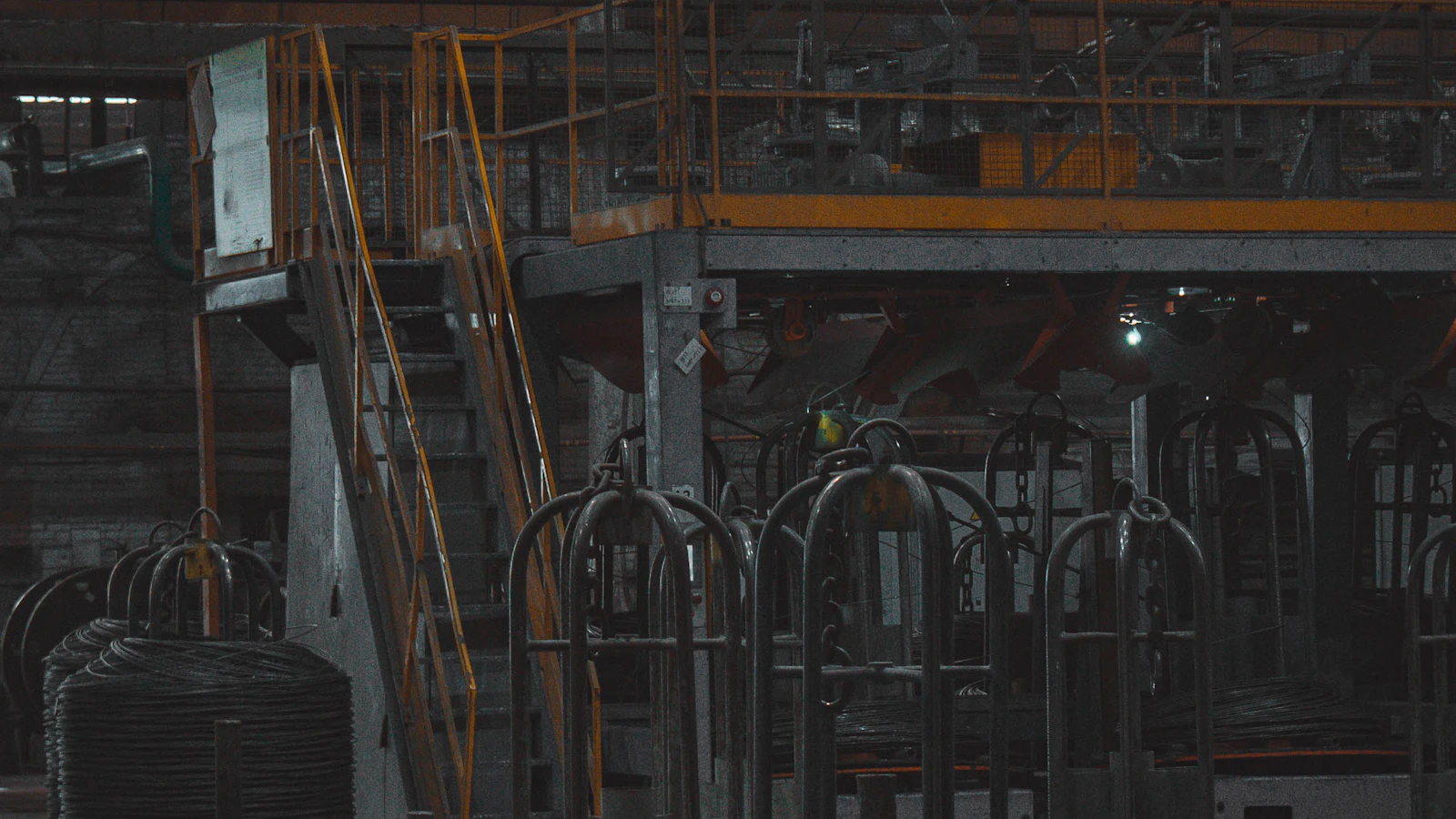 A man standing in front of a machine in a factory