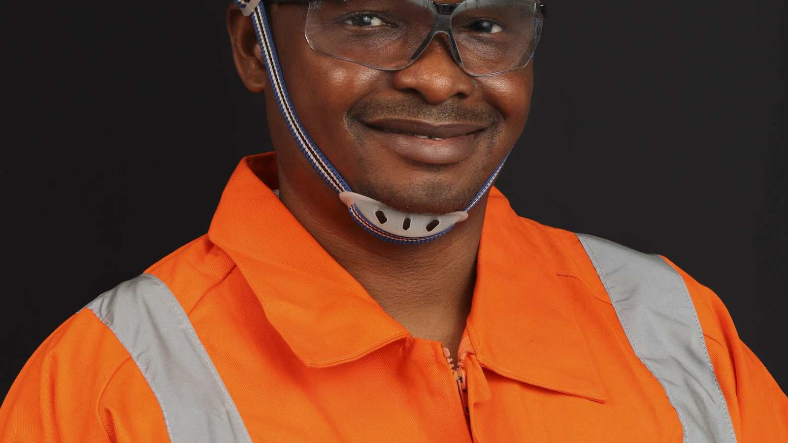 a man wearing a hard hat and safety gear