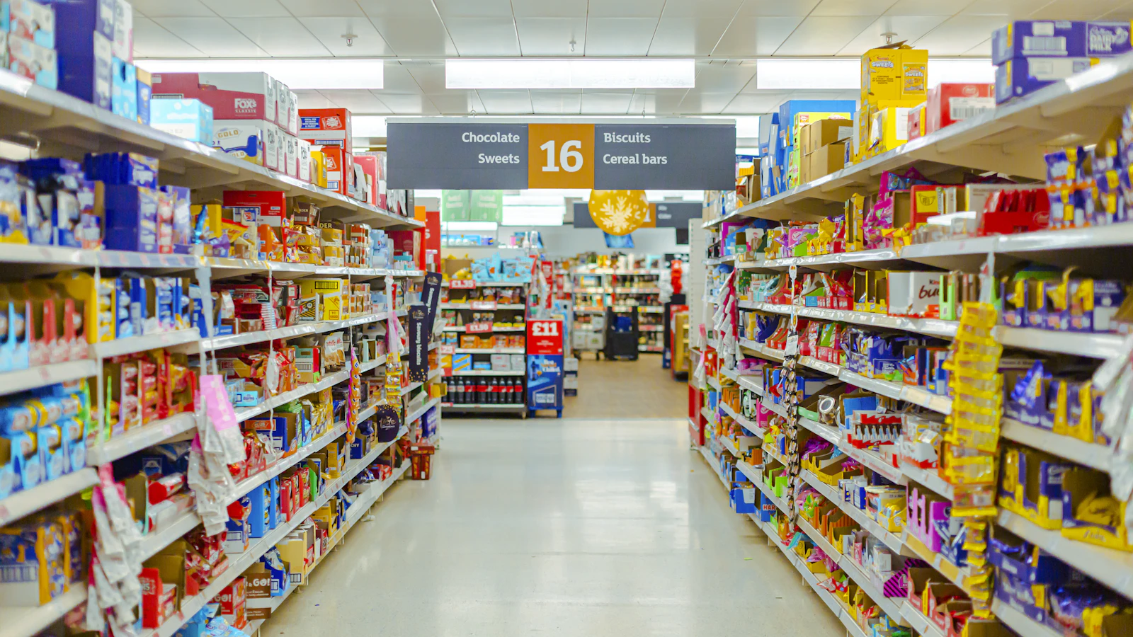 a grocery store aisle filled with lots of food
