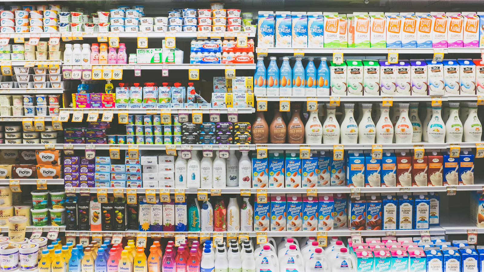 assorted drinks on white commercial refrigerator