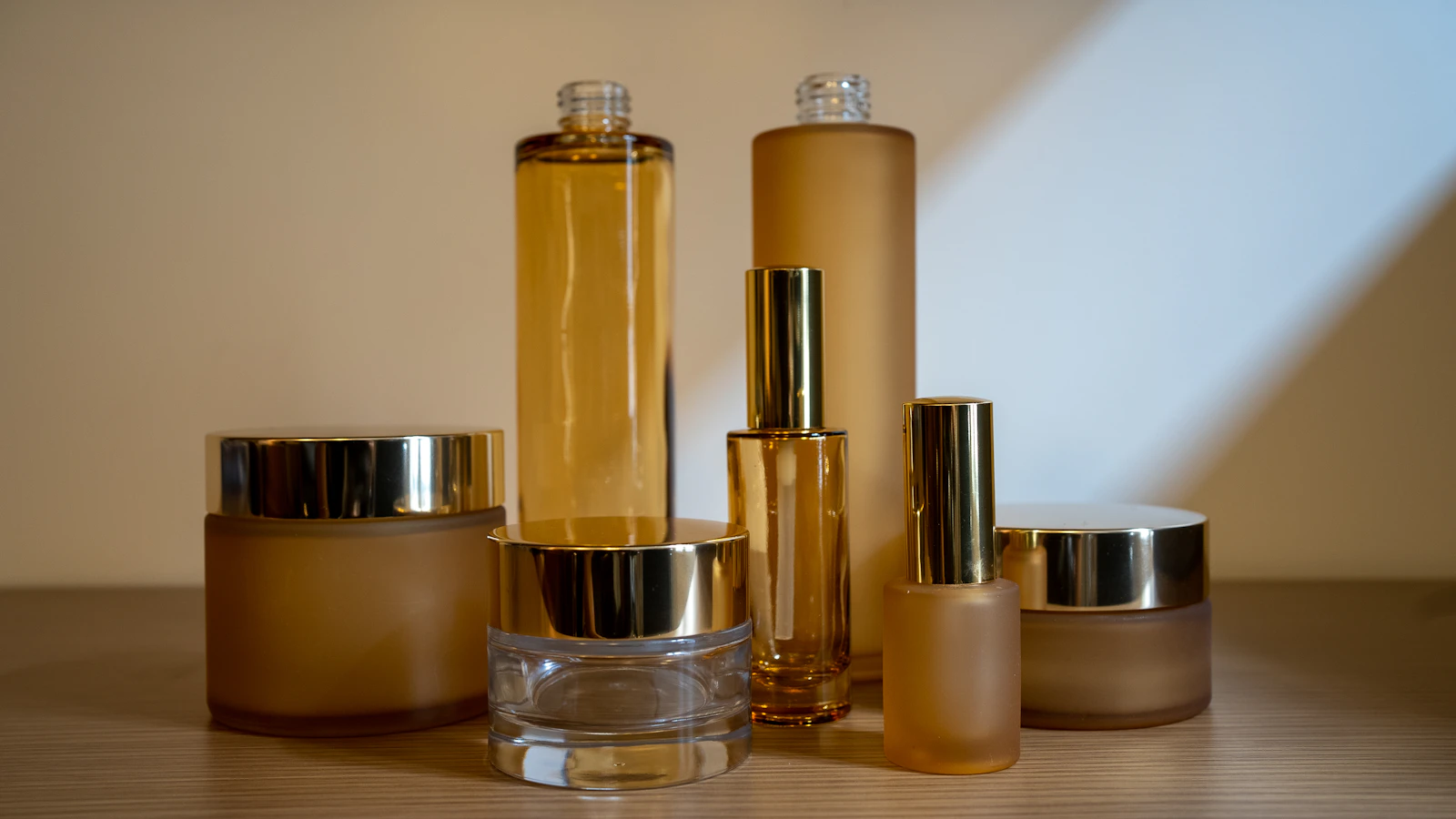 a group of bottles sitting on top of a wooden table