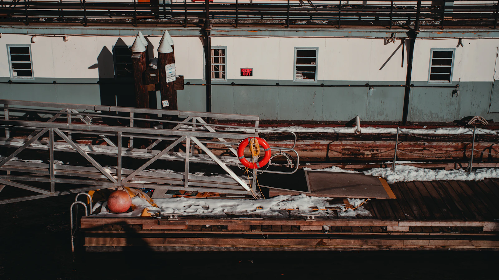 a rusted out boat sitting in a body of water