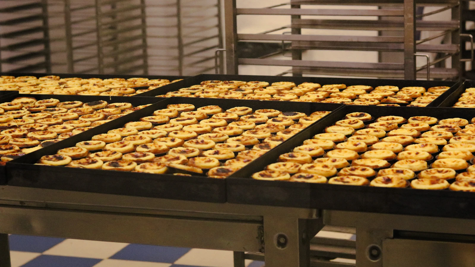 a conveyor belt filled with lots of pastries