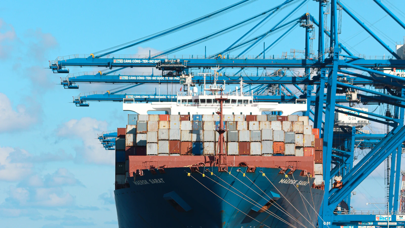 a large cargo ship at a dock