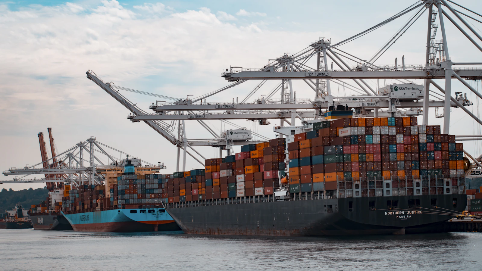 cargo ships docked at the pier during day