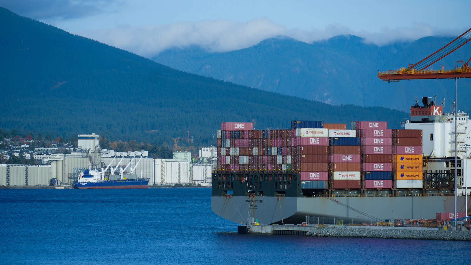 a large cargo ship in the middle of a body of water