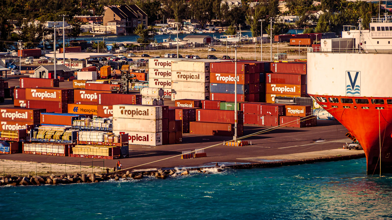 a large cargo ship docked in a harbor