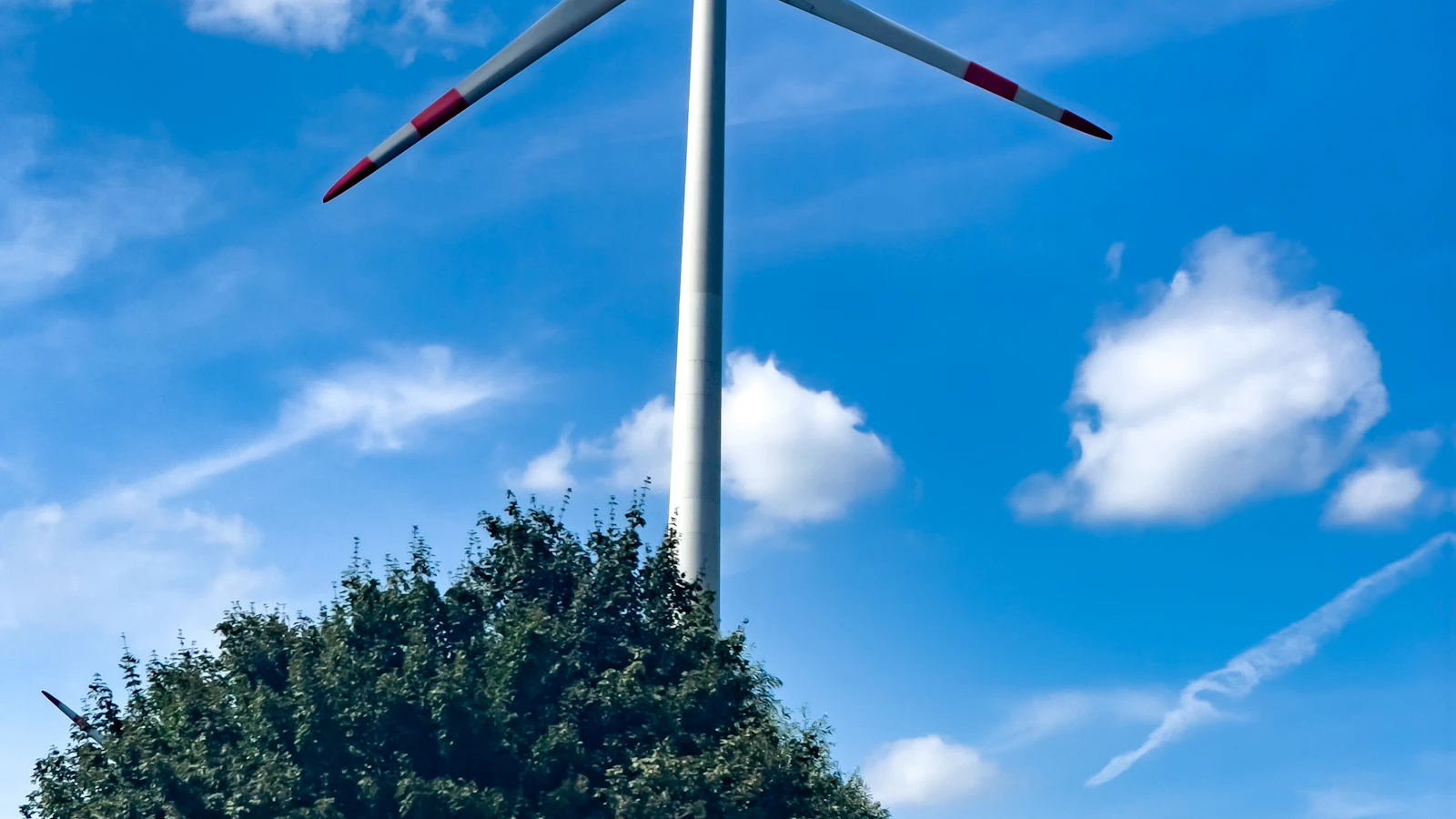 A wind turbine in the middle of a field